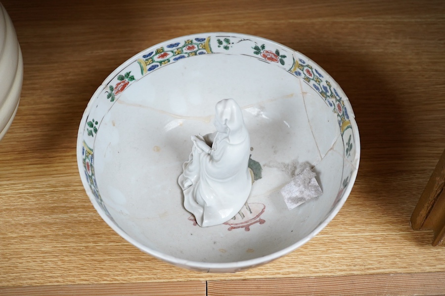 A Chinese famille verte bowl, Kangxi period and a white glazed figure of Guanyin, bowl 22cm diameter. Condition - figure good, bowl poor